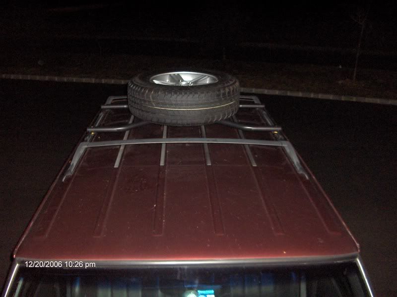 Jeep cherokee xj oem roof mount tire carrier #5