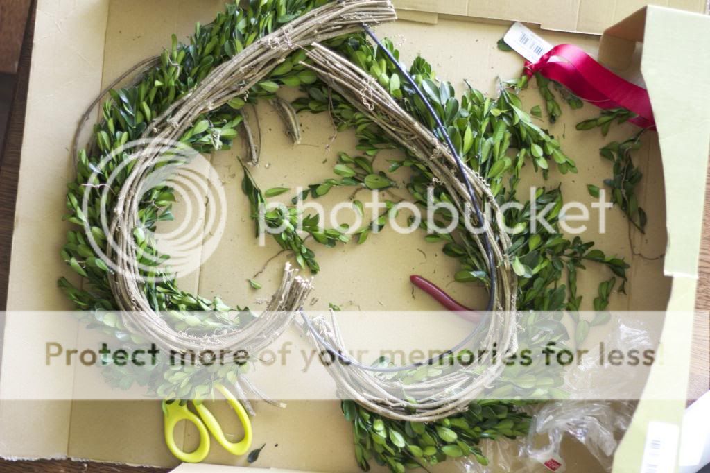 I have wanted a boxwood wreath for a long time. The price tag, not so much, Luckily I found an amazing deal on one, the only problem the shape.  See how I fixed that! 