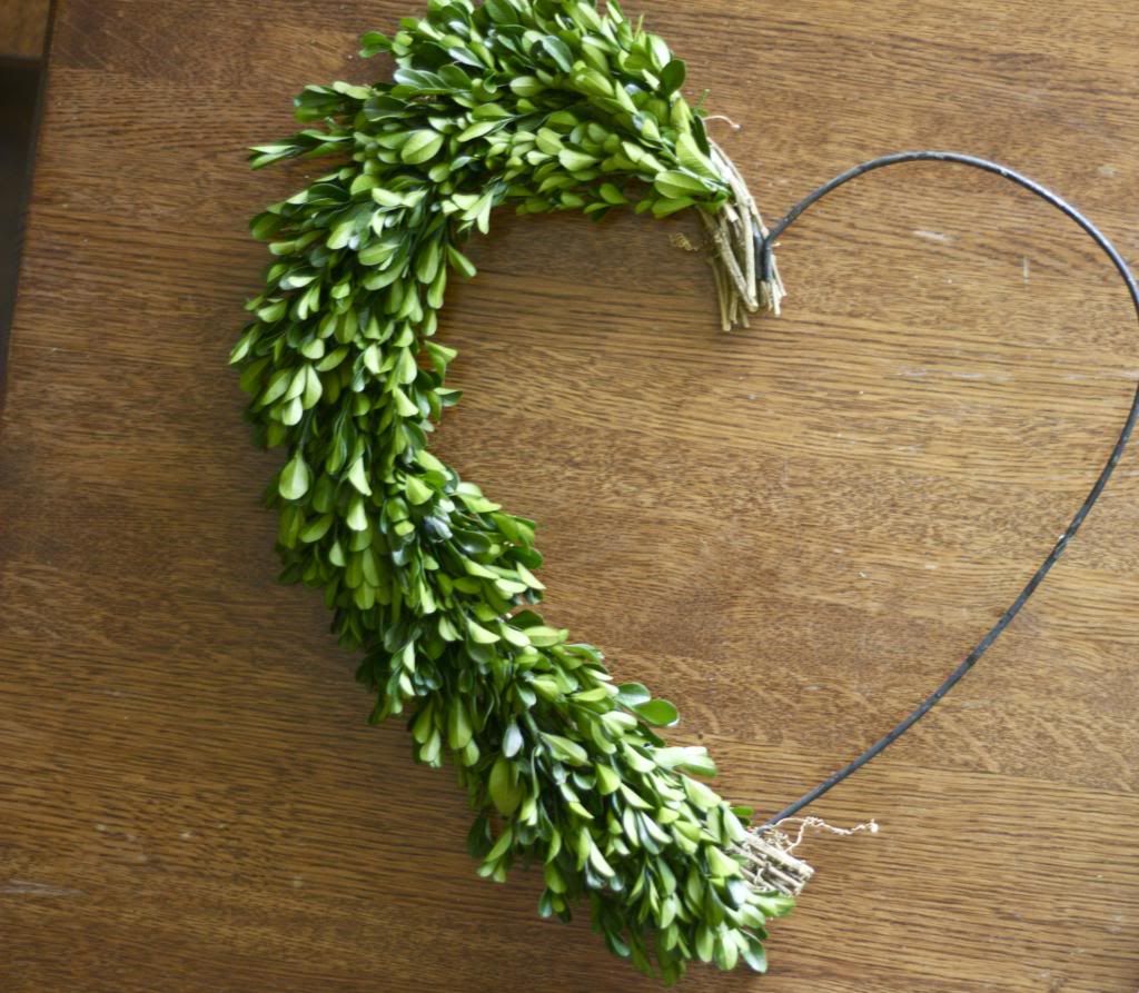 I have wanted a boxwood wreath for a long time. The price tag, not so much, Luckily I found an amazing deal on one, the only problem the shape.  See how I fixed that! 